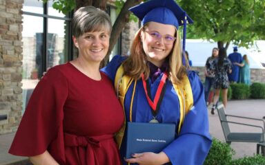girl with mom in her graduation