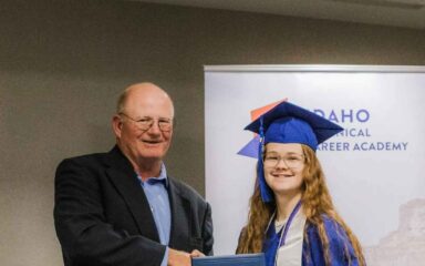 graduated girl with teacher