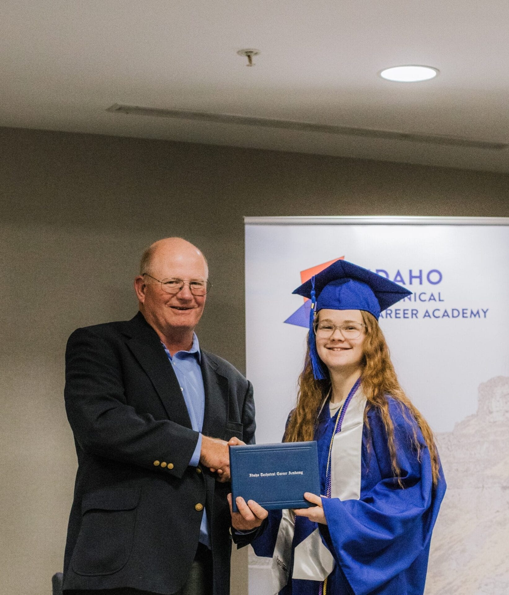 graduated girl with teacher